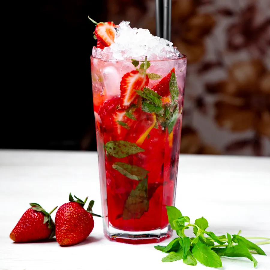 strawberry juice served in glass filled with ice